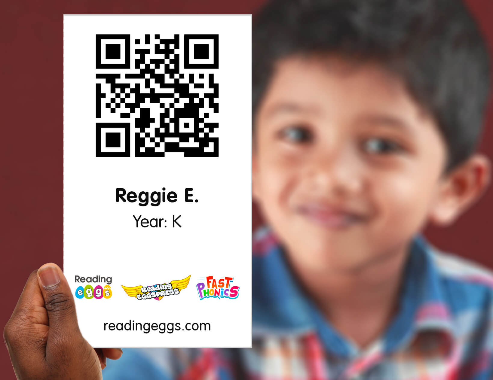 student holding a printout of a QR code to a camera